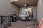 The back patio has a BBQ grill, dining table and outdoor fire pit